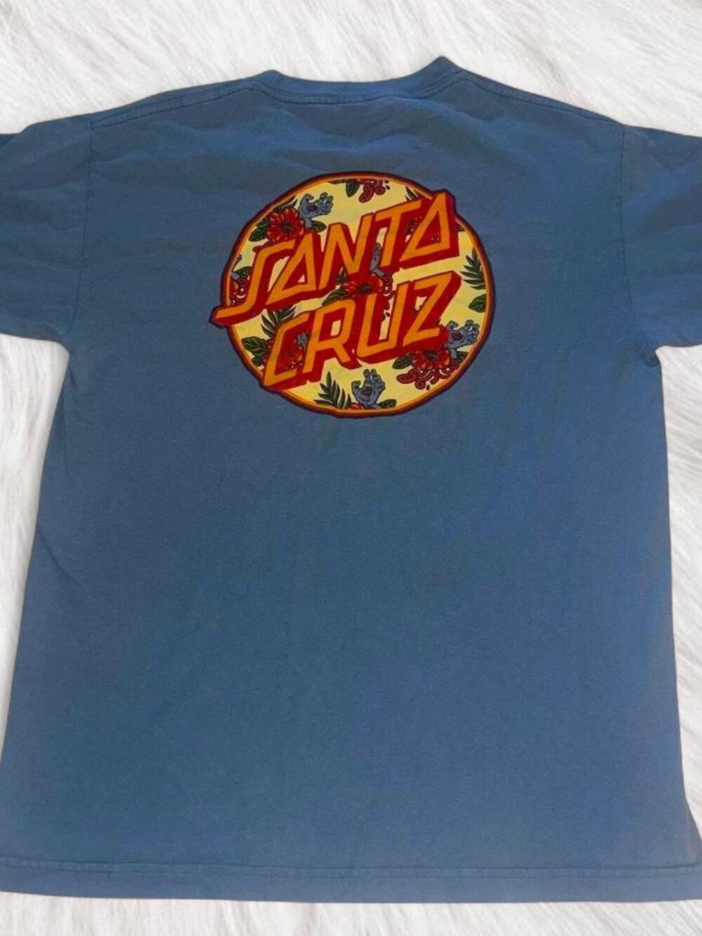 Santa Cruz blue t-shirt with floral design.